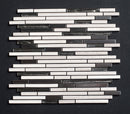 Mosaic tile pattern with black and white tiles on a dark background