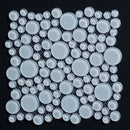 Mosaic pattern of white circular tiles