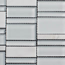 Close-up of a tiled wall with rectangular tiles in a grid pattern.