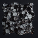 Black and silver sequin fabric on a black background