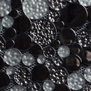 Close-up of black and gray circular tiles with a textured pattern