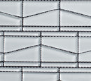 Mosaic pattern of rectangular tiles with black grout lines on a white background