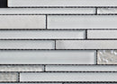 Close-up of a mosaic tile pattern with white and gray tiles.