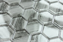 Close-up of hexagonal metallic tiles with a textured surface