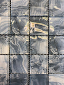 Patterned tiles with gray and white marbled design