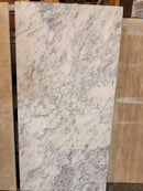Arabescato Marble 24x48 tile with textured leather finish and 3/4 inch thickness
