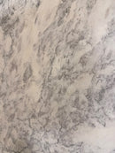 Close-up of Arabescato Marble 24x48 Leather Finish Tile showing natural gray veining

