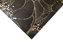 Black and gold floral mosaic tile with intricate botanical pattern by Mythology Tile, 18x18 inches, decorative ceramic design.