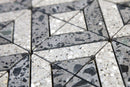 Close-up of grey terrazzo tile showing aggregate texture and pattern