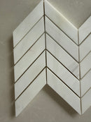 Dolomite chevron marble mosaic installed as a sophisticated kitchen backsplash