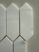 Dolomite picket honed marble mosaic installed as an elegant kitchen backsplash with soft matte finish