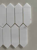Dolomite marble picket mosaic used on a modern bathroom shower wall with clean linear layout