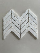 Dolomite polished 1x4 chevron marble mosaic tile featuring white marble and subtle gray veining