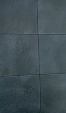Deep blue anti-slip porcelain tile installed around a luxury swimming pool
