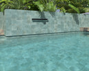 Teal anti-slip porcelain tile installed around a luxury swimming pool
