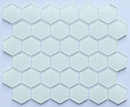 Hexagonal glass mosaic tiles on a light purple background