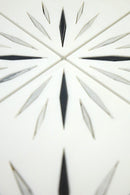 Close-up of Harmony White Waterjet Marble Mosaic Tile by Mythology Tile, showcasing intricate white and black marble pattern details.