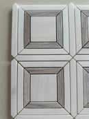 Natural stone accent wall featuring Dolomite and Palissandro marble mosaic
