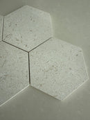 Shellstone Myra honed hexagon tile used as a kitchen backsplash