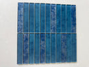 Roca Sapphire 12x12 stacked glass mosaic wall tile for shower walls, featuring a luxurious blue and clear glass design.