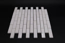 White ceramic mosaic tiles on a black background