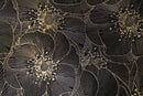 Close-up of Mythology Tile Golden Blossom Nero 18x18 floral mosaic tile with detailed black floral pattern and textured surface.