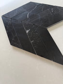 Premium polished black marble mosaic tile featuring a contemporary chevron pattern