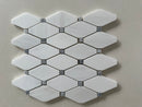 Dolomite polished octagon marble mosaic with blue dot inlay installed on a modern shower wall