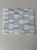 Natural stone tile from Roca's Rockart Blue Mix Thassos Picket mosaic, featuring blue and white Thassos stone for shower walls.