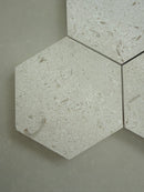 Shellstone Myra hexagon mosaic tile installed on a bathroom floor