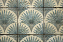 Close-up detail of palm-inspired digital pattern on tumbled travertine mosaic tile
