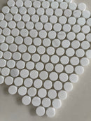 White Dolomite polished penny round mosaic tile with a timeless circular design