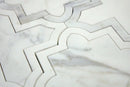 Close-up of honed white marble waterjet mosaic showing geometric detailing